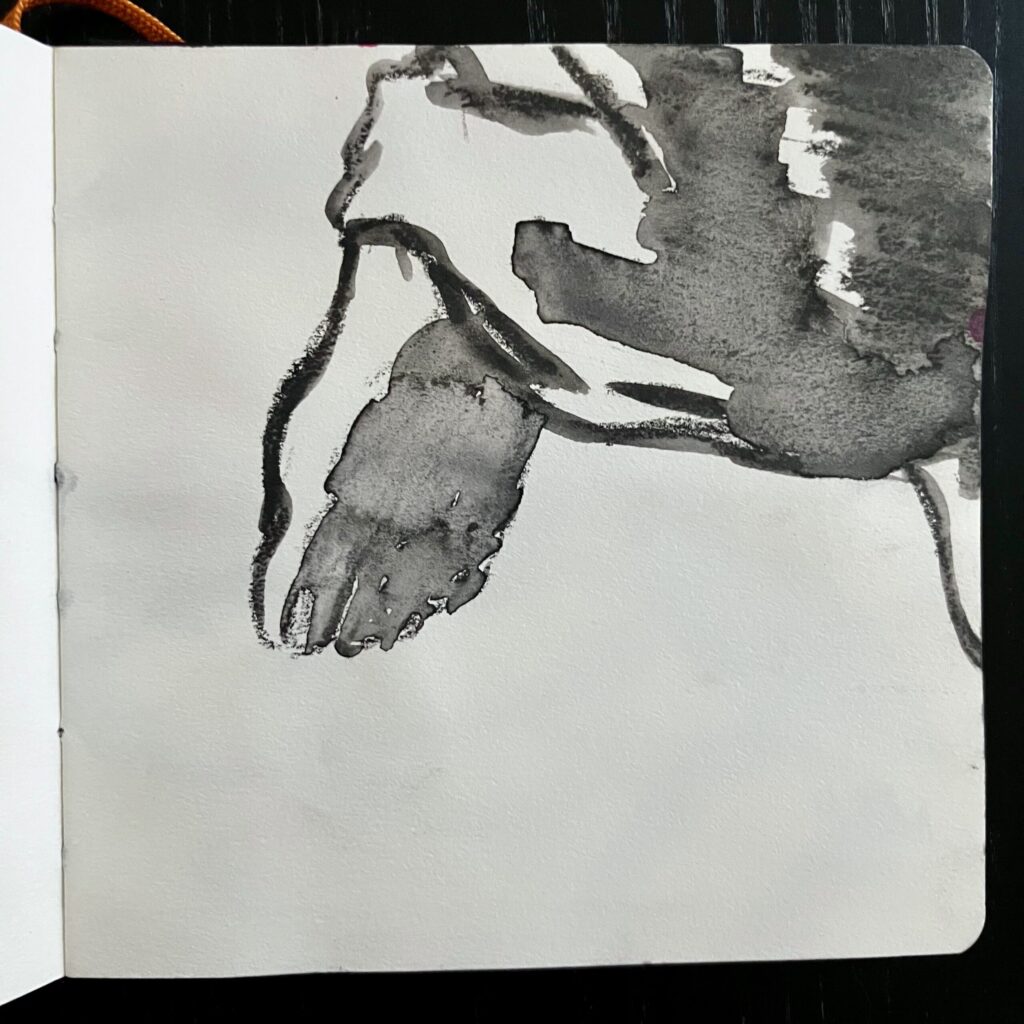A graphite drawing of a foot.