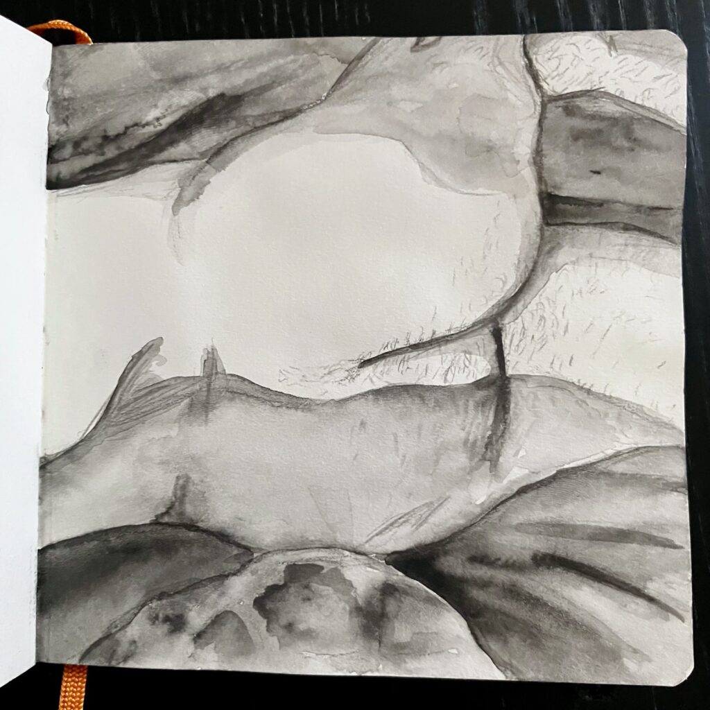 A nude drawing of a butt.