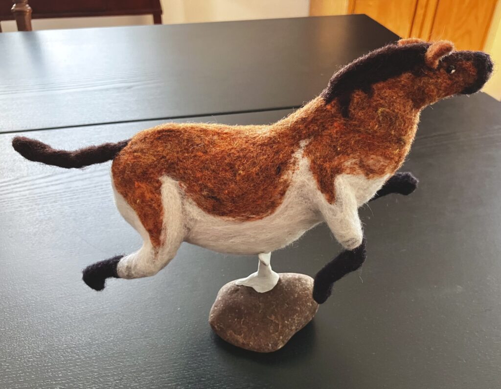A needlefelted fat horse.