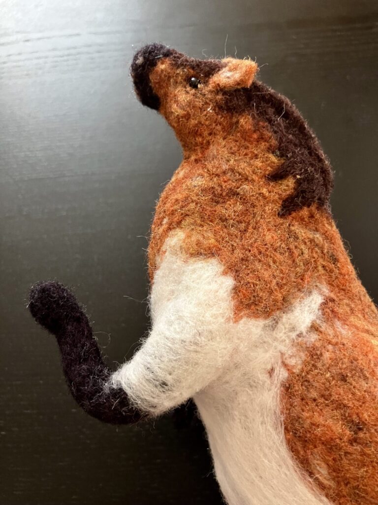 A needlefelted fat horse.