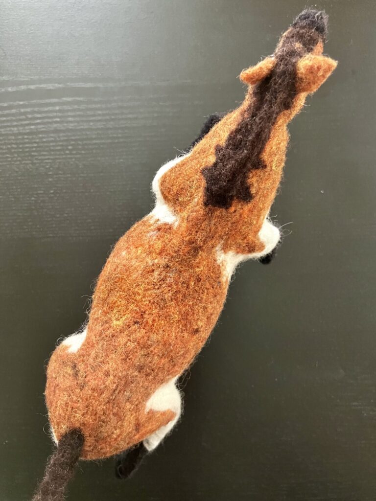 A needlefelted fat horse.