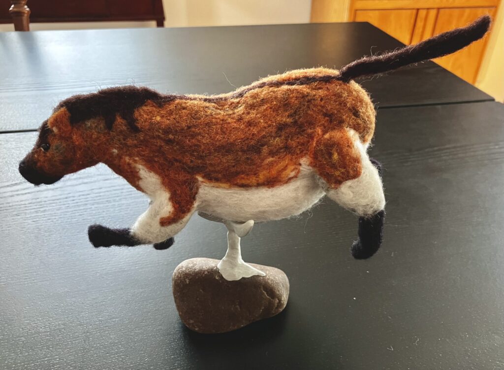 A needlefelted fat horse.