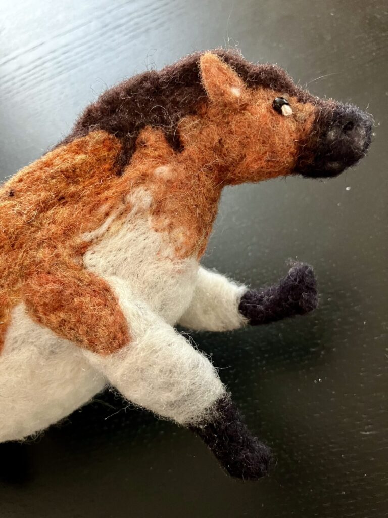 A needlefelted fat horse.