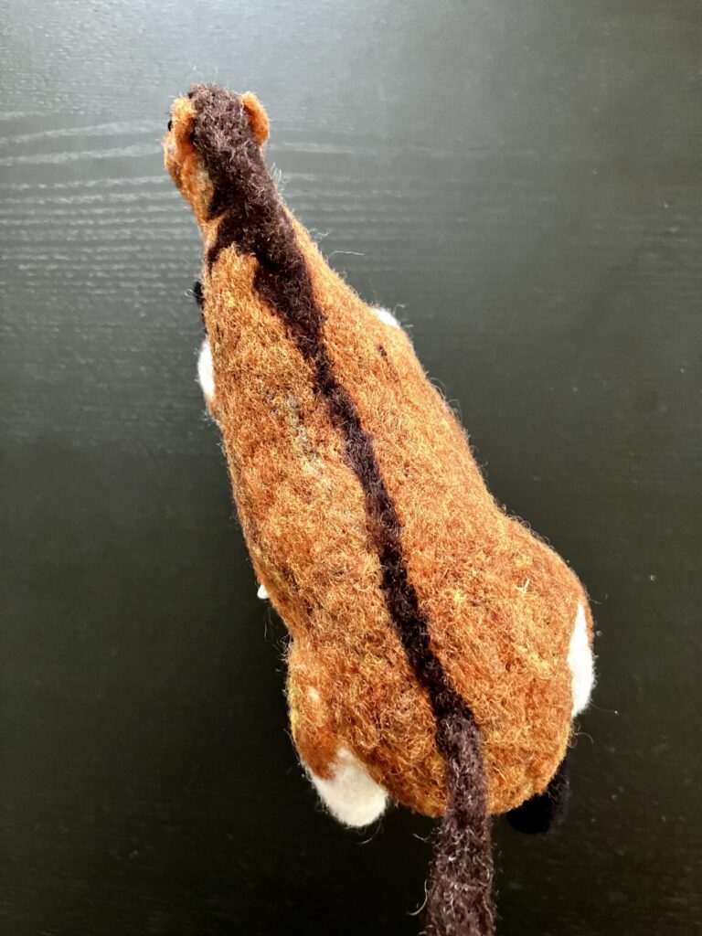A needlefelted fat horse.