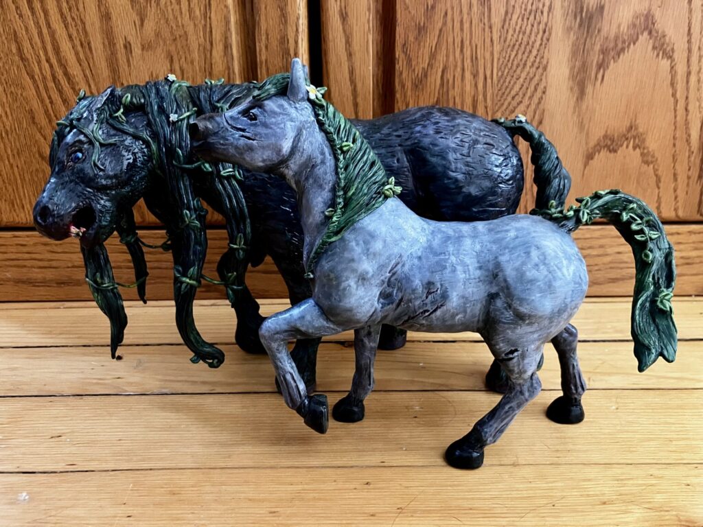 A photo of two sculpted waterhorses.